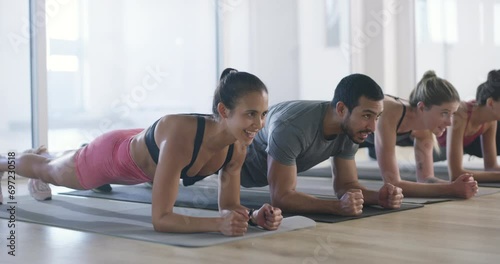 Group, planks or people in gym for fitness workout, body exercise or healthy wellness together. Diversity, teamwork or sports athletes in aerobics class for training core or strong abs with energy photo