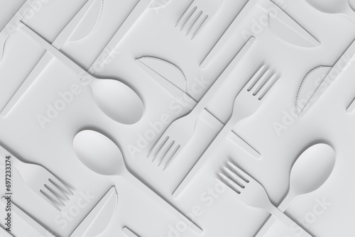 Set of disposable utensils like spoon, fork and knife on monochrome background.