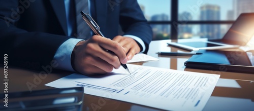A businessman signing a signature form documents for deal agreements concept photo