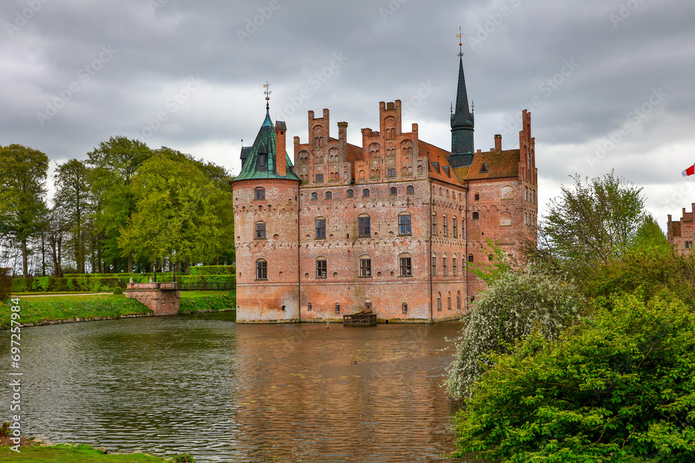 Denmark Egeskov Castle view on a cloudy spring day