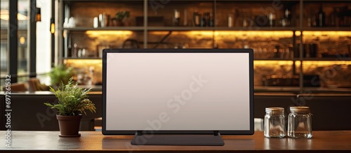 Black CEO showcasing empty computer screen for advertising mockup in office.