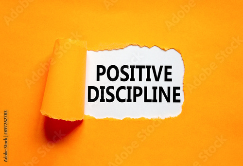 Positive discipline symbol. Concept words Positive discipline on beautiful white paper. Beautiful orange paper background. Business psychology positive discipline concept. Copy space. photo