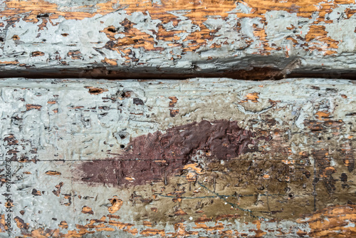 Fragment of an old wooden painted wall as a background or texture. Structure of an old wooden painted wall. Texture background of old wooden painted wall.