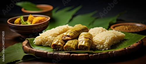 Traditional Kerala snack made with rice, dry coconut, jaggery ghee, and banana leaf, popularly called undampori. photo