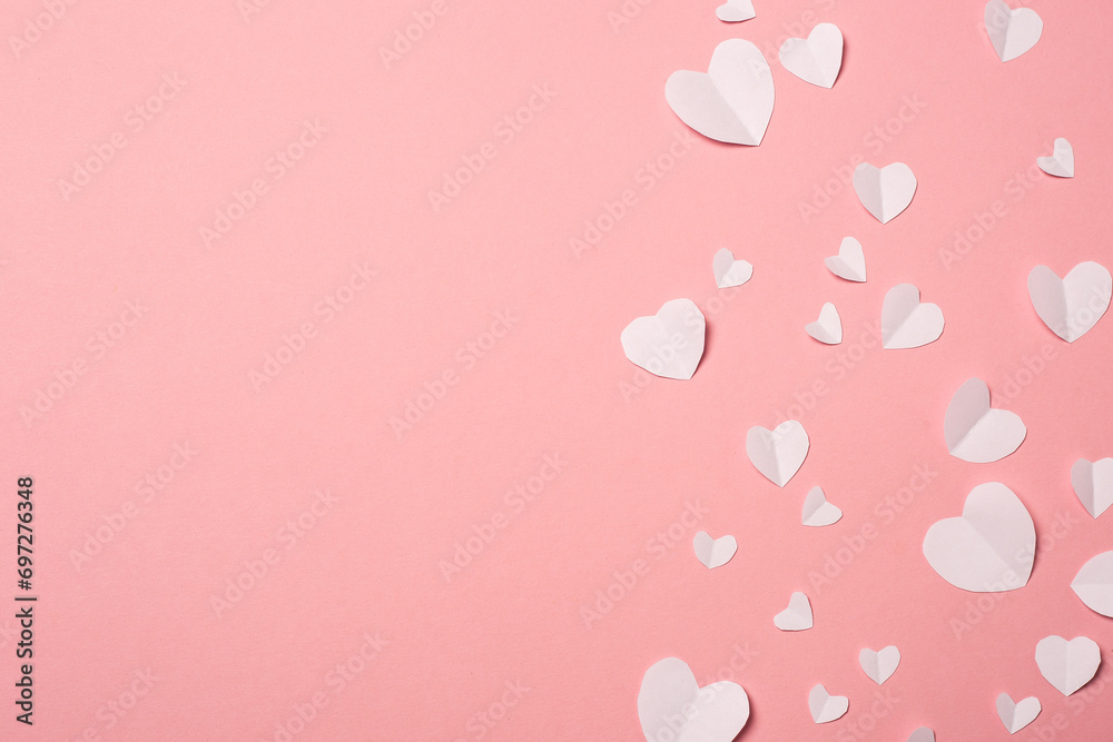 White paper hearts on a pink background. Composition of Valentine's Day. Banner. Flat lay, top view