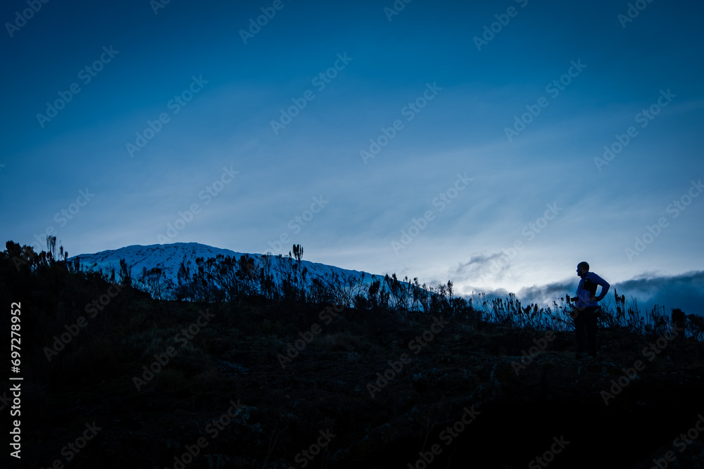 Man watching Kilimanjaro at dawn