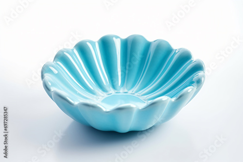 a blue bowl sitting on top of a white table