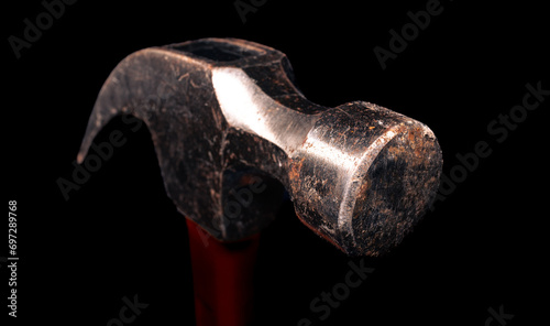 Cuadro en lienzo Iron hammer with an orange handle in the dark