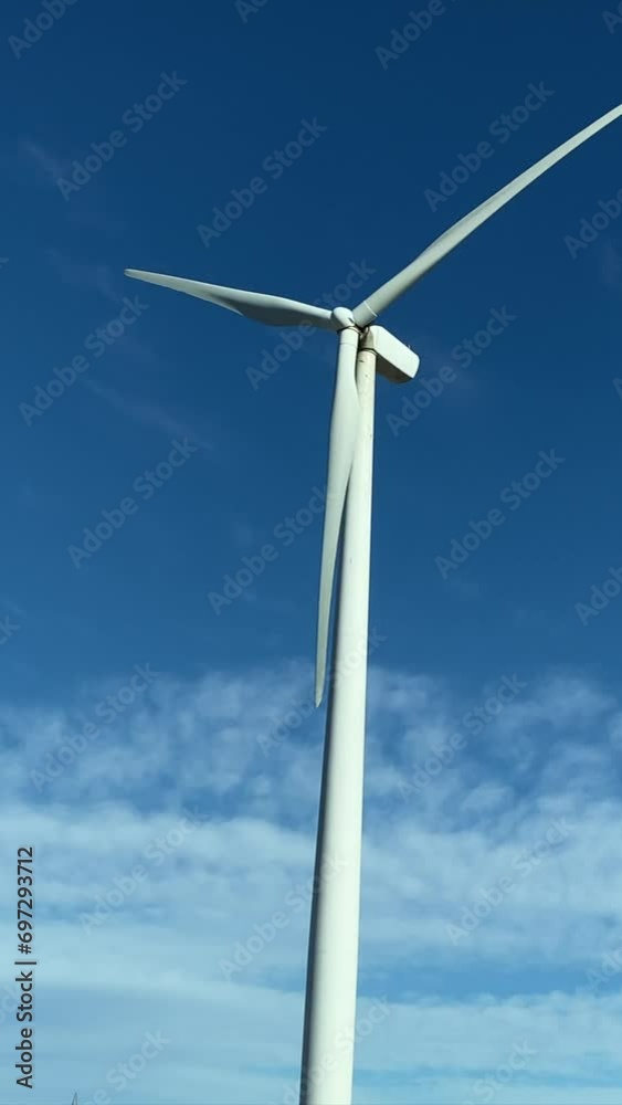 Line of Massive Wind Turbines, subjective visit from a car. Concept of ecological transition renewable energy climate change green energy. There is no planet b. Green energy choice concept. Line of Massive Wind Turbines, subjective visit from a car. Concept of ecological transition renewable energy climate change green energy. There is no planet b. Green energy choice concept.