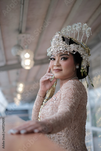 Asian Female Wedding portrait of a bride in dress Kebaya Payet Sundanese Culture