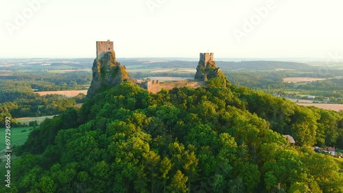 Trosky Castle aka Hrad Trosky aerial sunset view. Famous landmark, one of the main symbols of the Bohemian Paradise. Tourist destination popular for its romantic atmosphere and unique exterior. photo