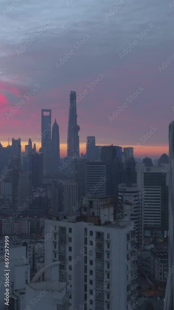 Shanghai Skyline at Pink Sunrise. Panoramic Aerial View. China. Drone is Flying Upward and Sideways. Establishing Shot. Vertical Video Shanghai Skyline at Pink Sunrise. Panoramic Aerial View. China. Drone is Flying Upward and Sideways. Establishing Shot. Vertical Video