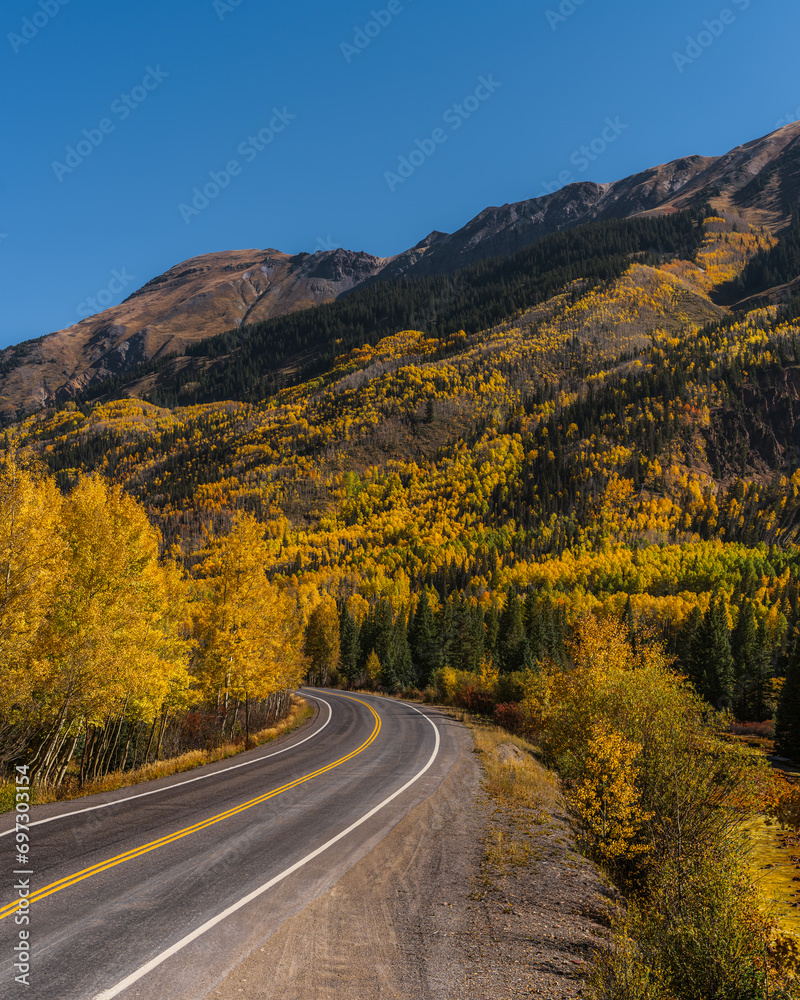 Fototapeta premium American Scenic Road Colorado Million Dollar Highway Scenic Vista Mountain Road in Autumn Yellow Aspen Trees Curved Road