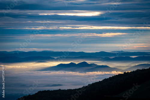 Hills emerging from the mist from Karisimbi volcano, Rwanda photo