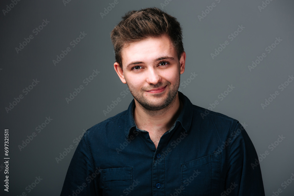 A Man in a Black Shirt Smiling at the Camera A Man in a Black Shirt Smiling at the Camera