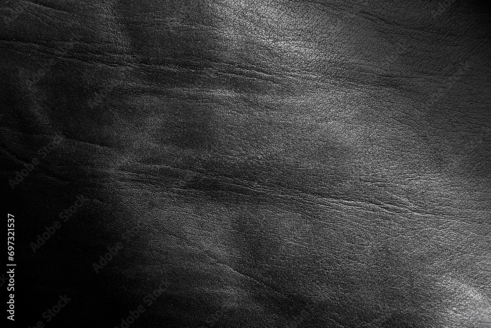 Fototapeta premium Texture of genuine black leather. Leather background with gradient