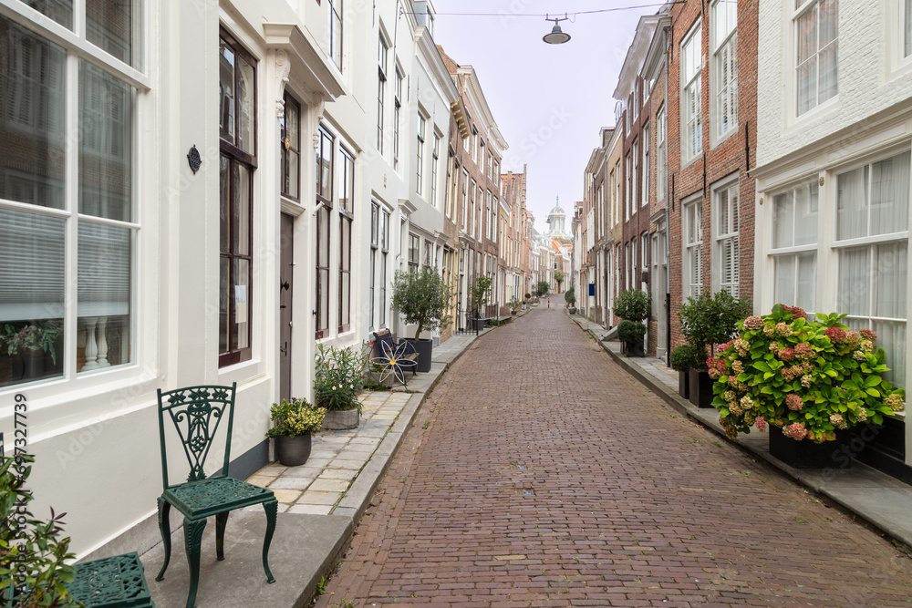 Narrow street with planters in the center of the city of Middelburg in Zeeland