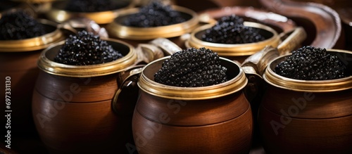 Small barrels filled with Russian Black Caviar. photo