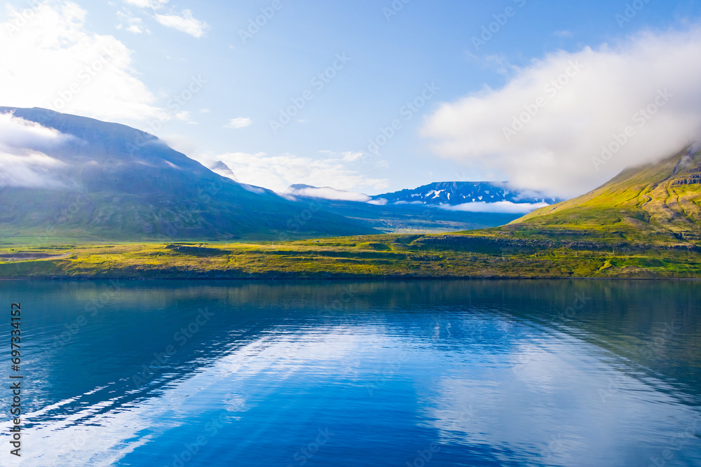 Beautiful Green Landscape and Blue Ocean of Seydisfjordur, Iceland cpatured during early morning