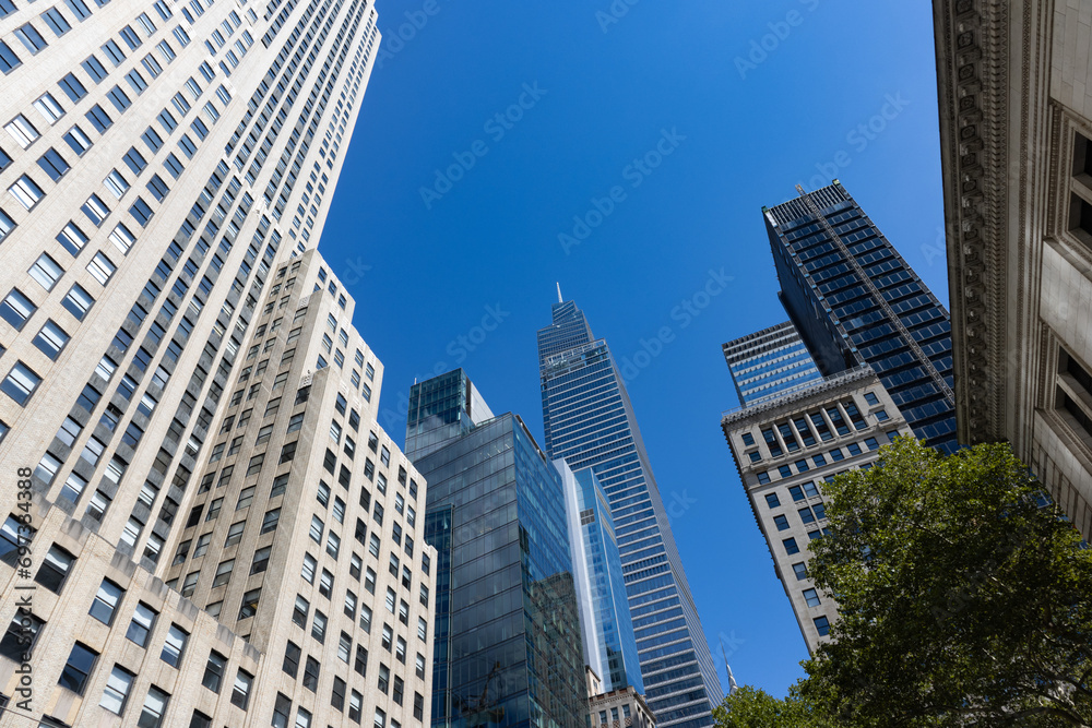 Beautiful Buildings and Skyscrapers with a Blue Sky in Midtown Manhattan of New York City Beautiful Buildings and Skyscrapers with a Blue Sky in Midtown Manhattan of New York City