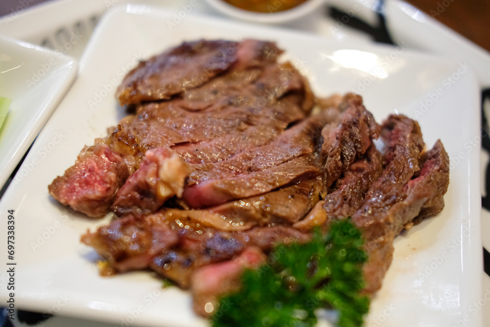 Medium rare steak meat served on plate
