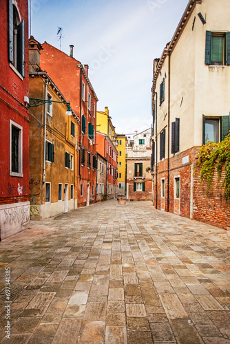 cozy narrow street with colorful houses in Venice early in the morning. Journey © Nataliia Makarovska