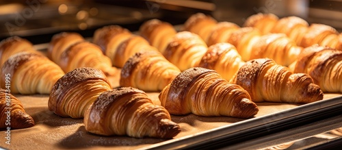Fresh classic pastries are taken from the baking sheet.