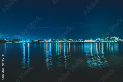 Navegantes Marina, cargo ship moored in Navegantes-SC at night with cranes taking the containers, photo taken from inside the ferry boat