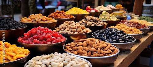 Assorted nuts, fruits, and food for sale at the bazaar.