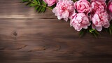 Peony flowers in photo on wooden table