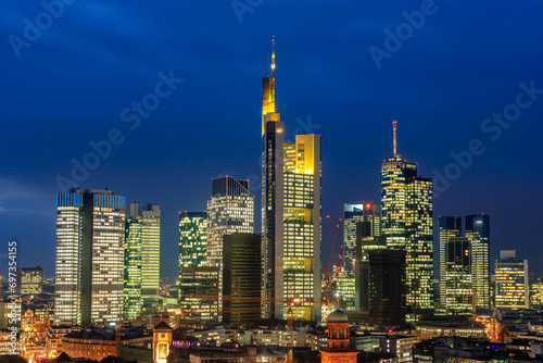 The skyline is a modern city with light in the sunset. Beautiful city photo right in the center. Financial center in Frankfurt am Main in Germany