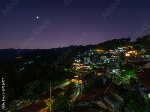 CHIANG RAI - THAILAND - December 16, 2023: Night time of peaceful village on the mountain at border of Thailand in winter season at Ban Pha hee. photo