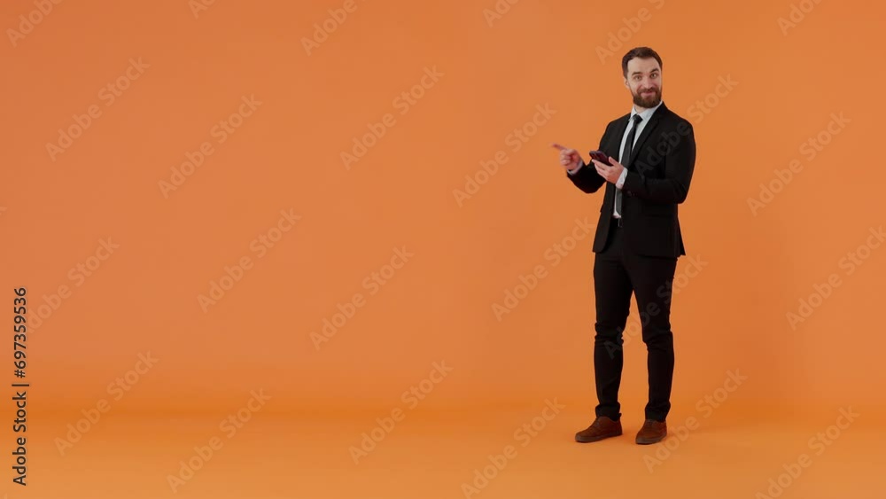 Happy bearded businessman holding smartphone, winning lottery Happy bearded businessman holding smartphone, winning lottery