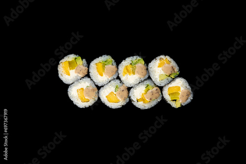Delicious rolls of Japanese cuisine. Dark background