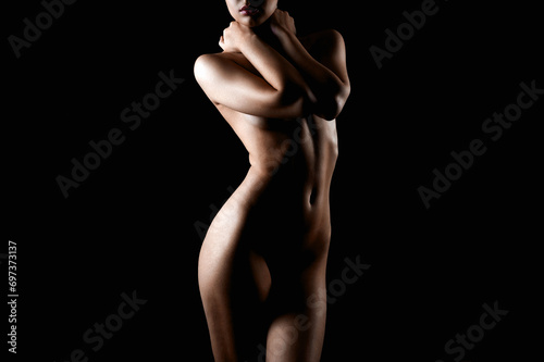 Nude Woman silhouette in the dark. Beautiful Naked Body Girl