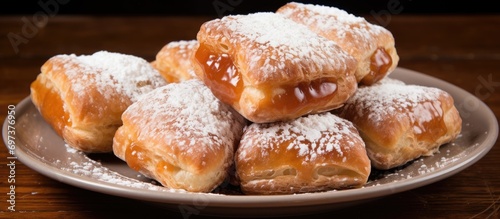 Argentine sweet pastries called pastelitos are made with fried dough and filled with sweet membrillo or sweet potato. photo