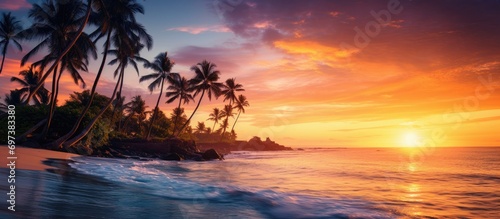 Stunning sunset over palm trees and ocean, perfect for a summer getaway. © TheWaterMeloonProjec