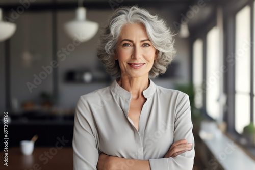 An elderly, active businesswoman smiles. Healthy active longevity concept