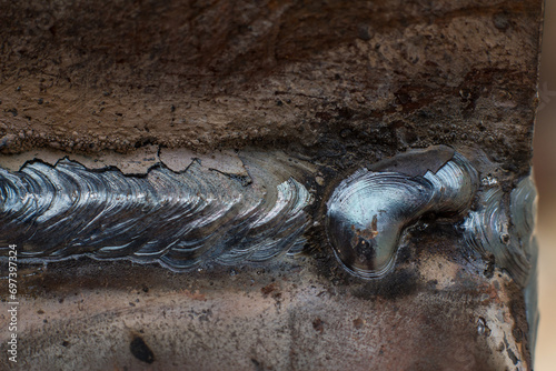 Welding seam on metal close up, welding work with metal