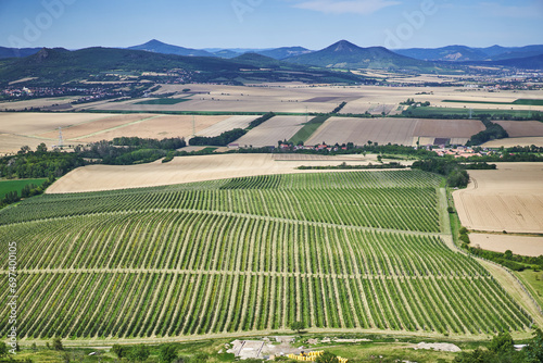 Arieal view of culture countryside of Central Bohemian Uplands a geomorphological region in northern Bohemia of Czech Republic with many fields for crop production and apple, pears and cherry orchards