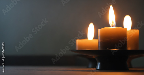A solemn photo capturing the essence of remembrance and honor: a table adorned with candles, symbolizing hope and commemorating the Holocaust. photo