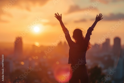 Inspiring City Sunrise with Silhouette of Woman Raising Arms