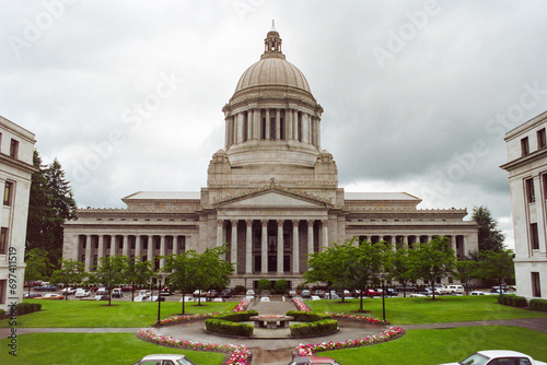 Grainy archival film photograph of the Washington State Capitol Building with cloudy sky.  Shot May 1992.   photo