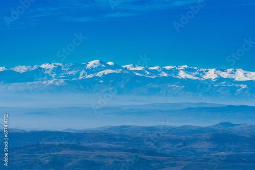 Mountain peak covered with snow. Horizon view. Winter landscape. Blue sky. Layers. Somewhere in Macedonia 2023