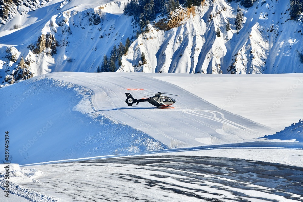Helicopter on Courchevel airport by winter 