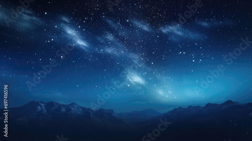Starry night sky over mountainous landscape
