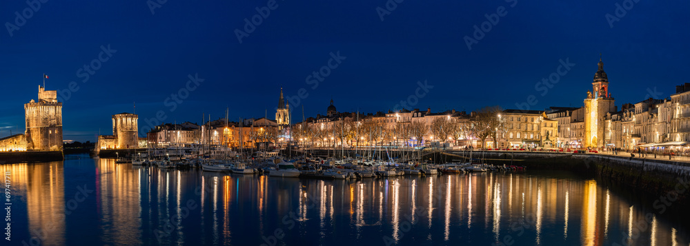 beautiful illuminated cityscape of the old harbor of La Rochelle at night