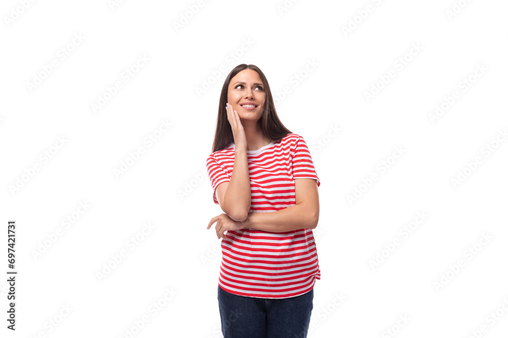 young positive smiling european woman with straight black hair in a striped red t-shirt on a white background young positive smiling european woman with straight black hair in a striped red t-shirt on a white background
