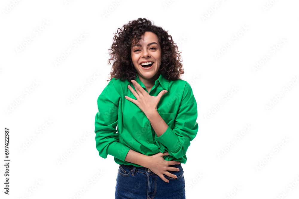 young active european brunette woman with curly hairstyle in green shirt works in an advertising agency young active european brunette woman with curly hairstyle in green shirt works in an advertising agency