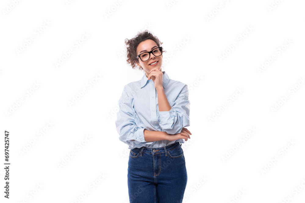 smart stylish young brunette curly employee of the company woman dressed in a light blue shirt on the background with copy space smart stylish young brunette curly employee of the company woman dressed in a light blue shirt on the background with copy space